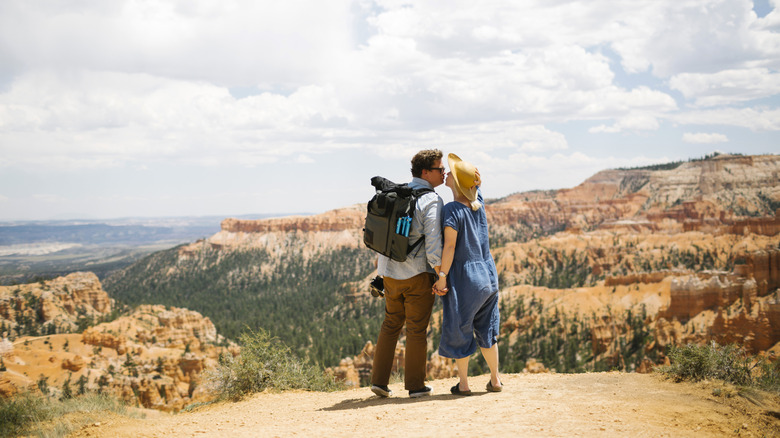 A couple sharing a kiss at the Grand Canyon