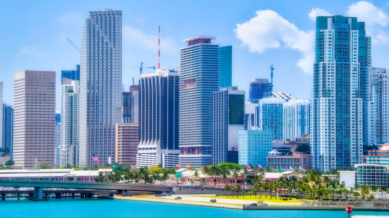 Tall buildings on the Miami skyline next to the water.